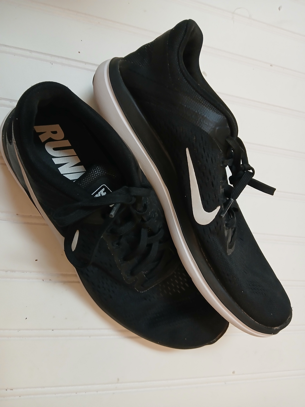 Nike Black Athletic Running Shoes with White Swoosh